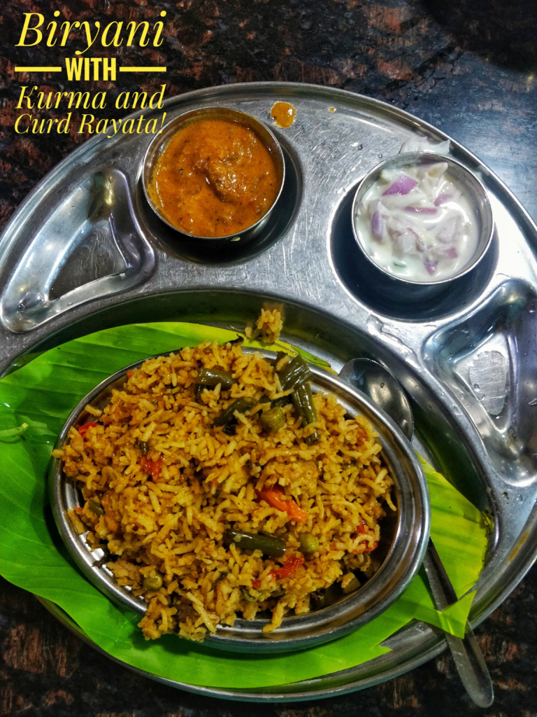 "Famous vegetarian food featuring flavorful vegetable biryani served with kurma and fresh curd raita on a traditional banana leaf."