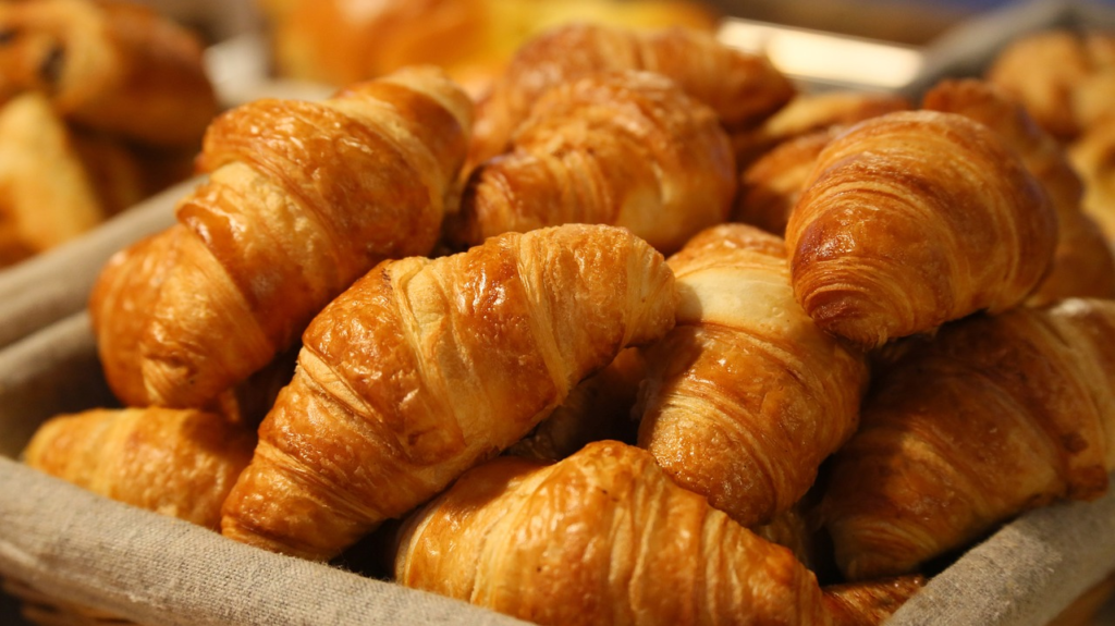 Delicious famous food croissants with crispy flaky texture on display